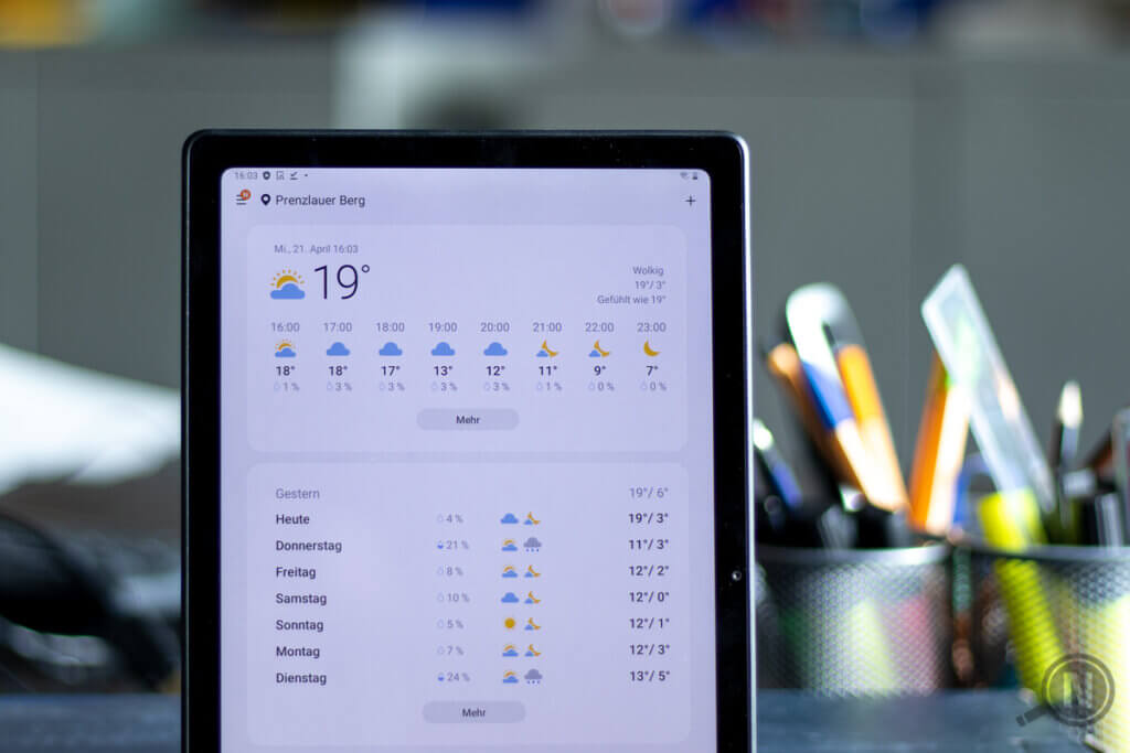 android tablet with weather on display