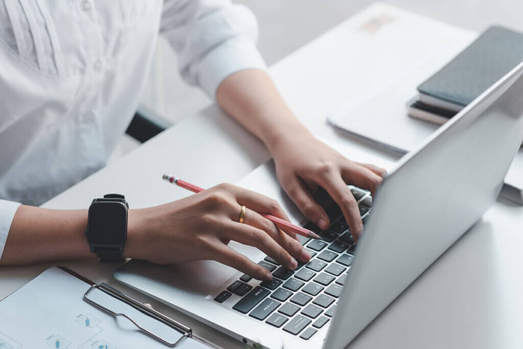 Man typing on a laptop