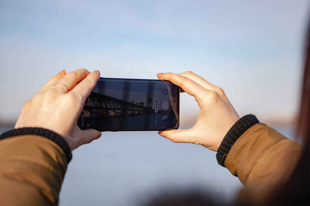 Hands holding up smartphone