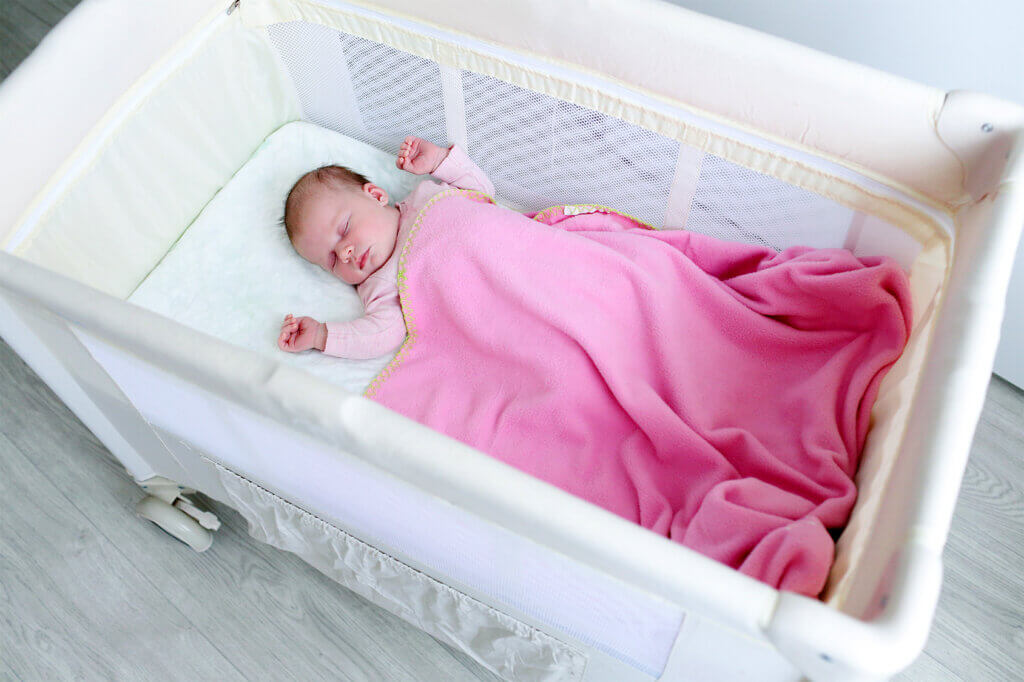  Baby with pink blanket
