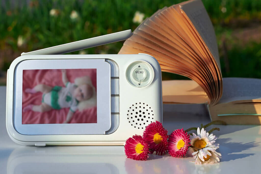 baby_monitor_on_garden_table_with_book