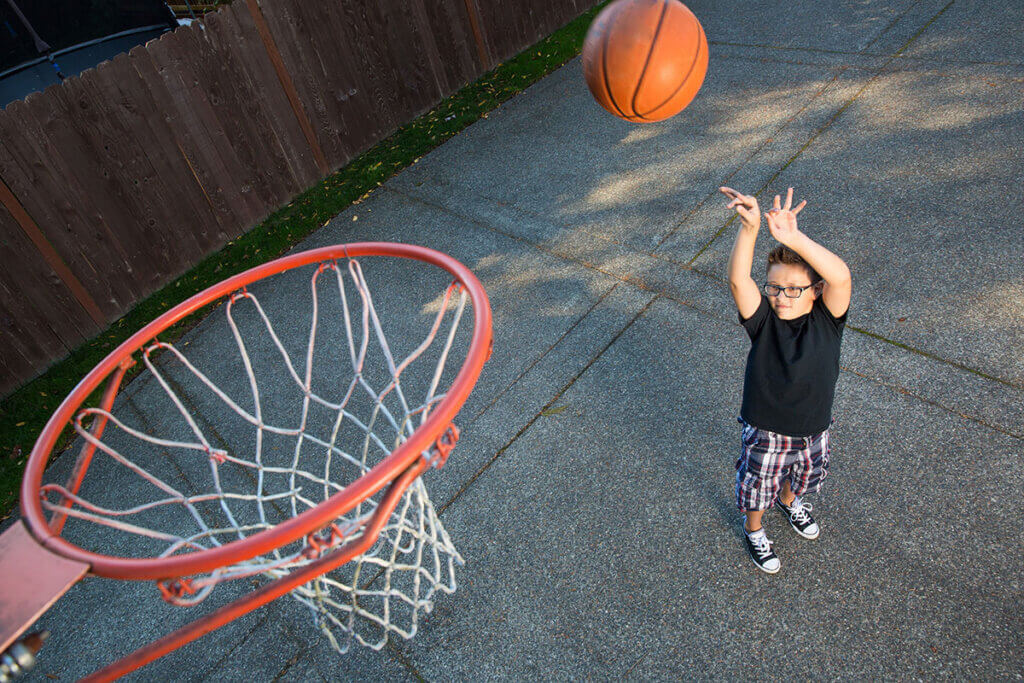 child exercising free throw