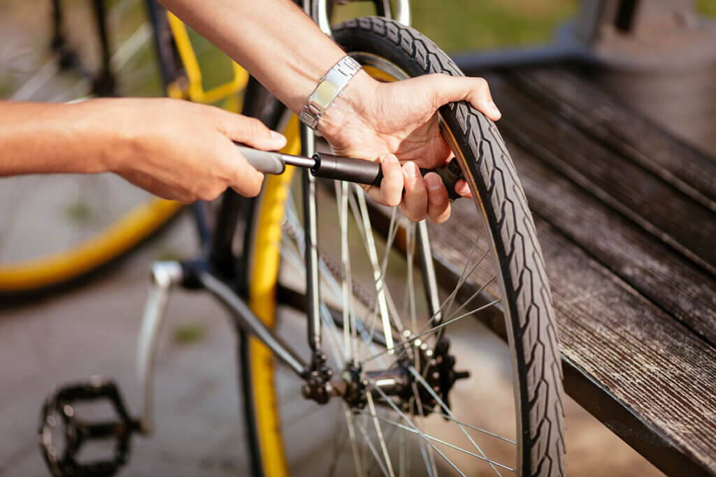 Person inflates tyre