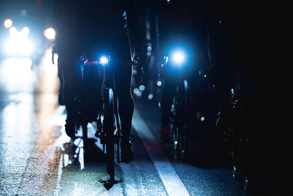 group of cyclists at night