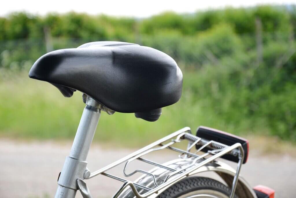 black saddle on a silver bike outdoors