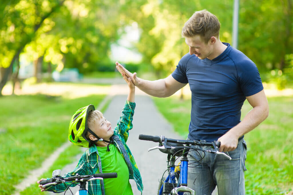 father and son with bikes