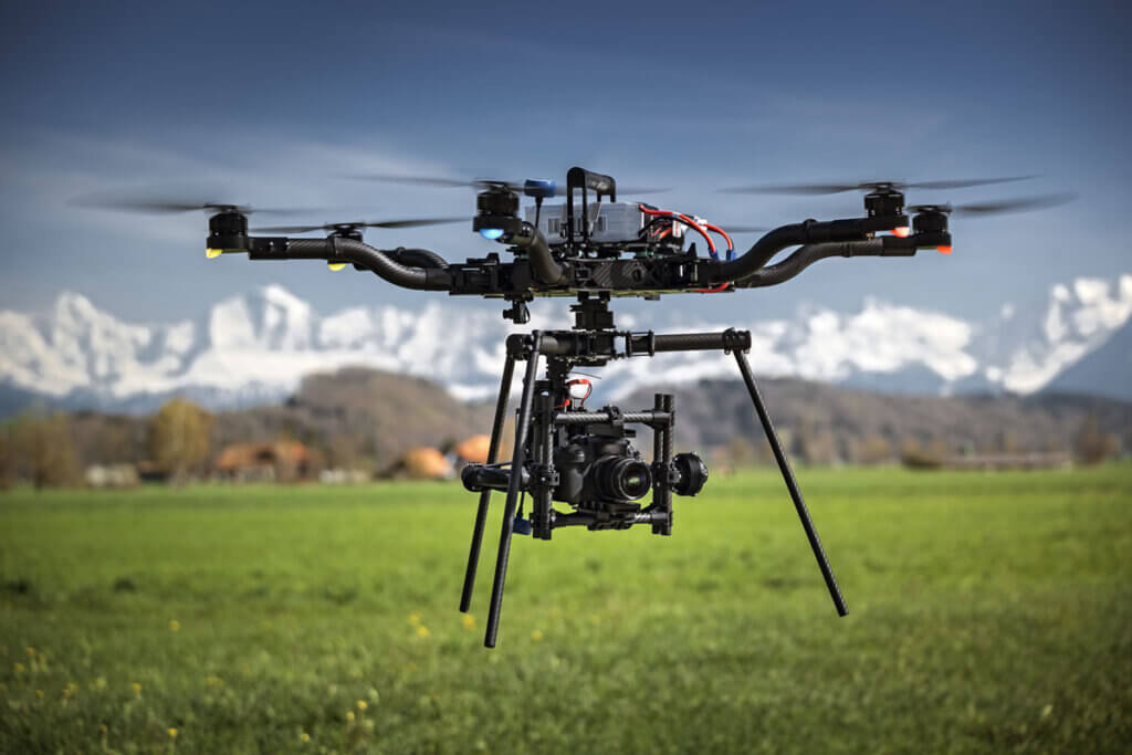 Drone flies over meadow