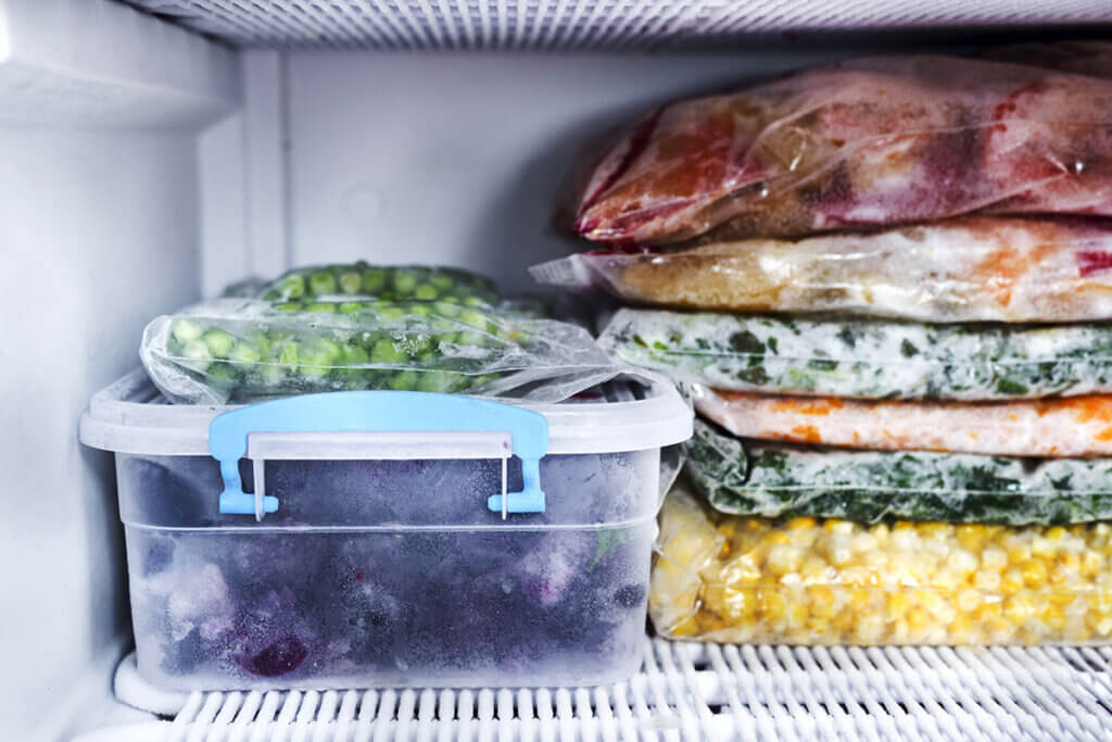 frozen berries and vegetables in freezers