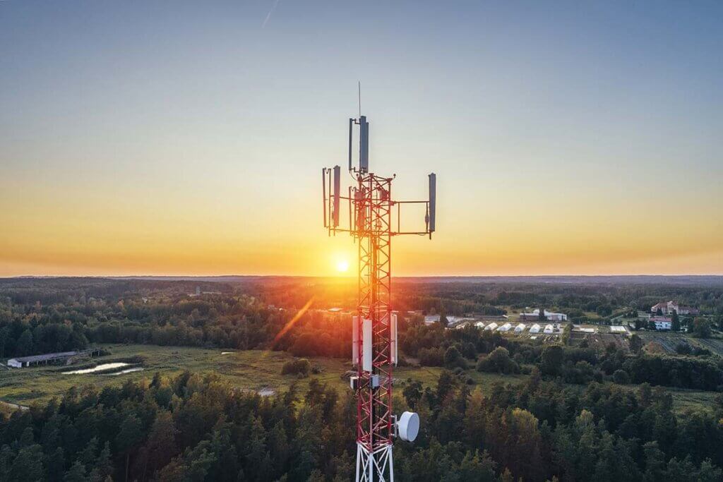 radio tower in the forest at sunrise