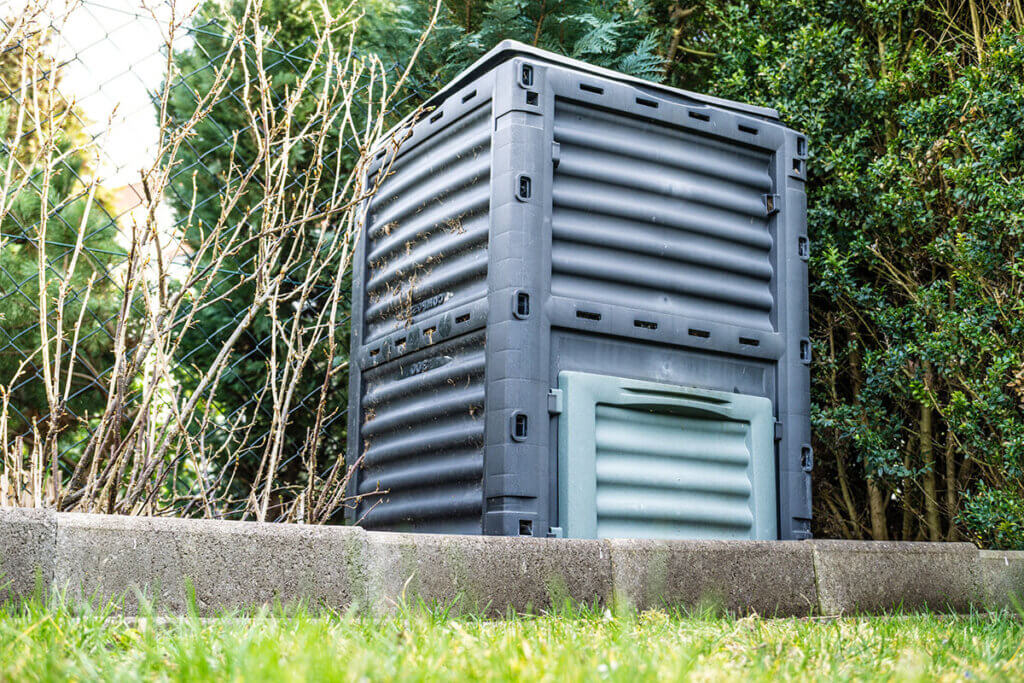 A closed quick composter in the garden