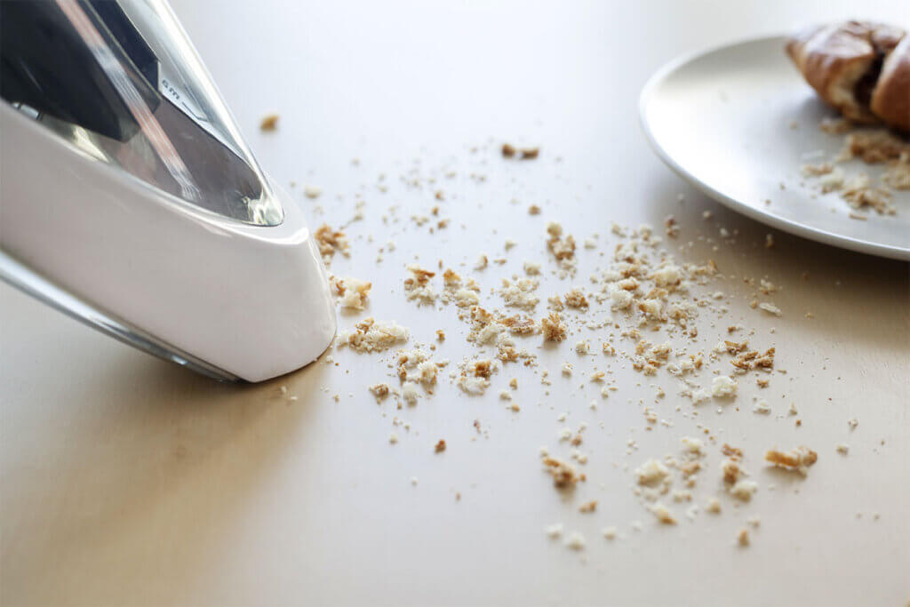 vacuuming breadcrumbs