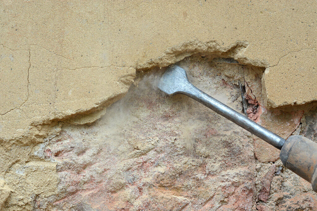 Hammer drill knocking off plaster