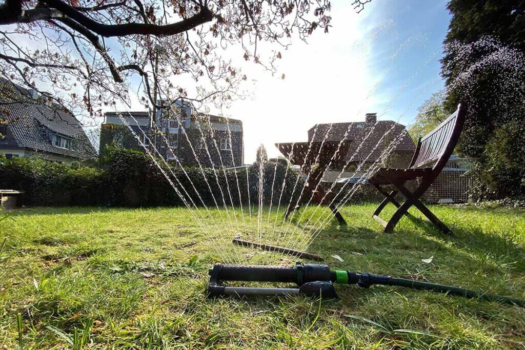 Lawn sprinklers in the garden in operation