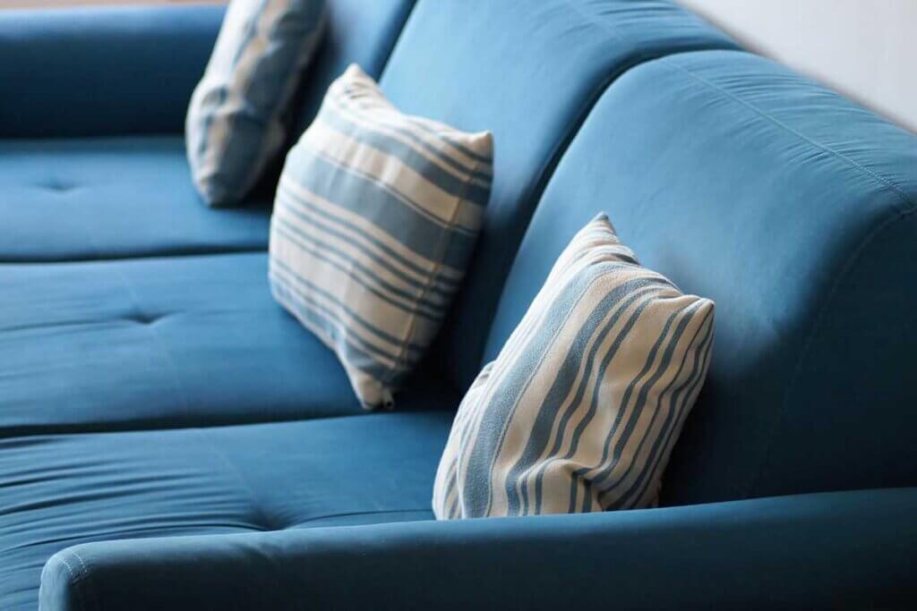 pillow on blue sofa