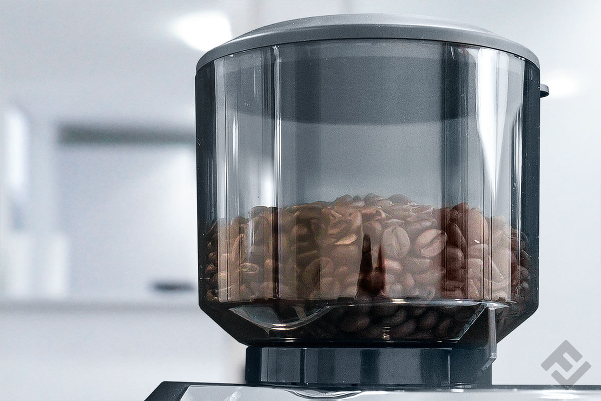 Close-up of the coffee bean container of De'Longhi's electric coffee grinder