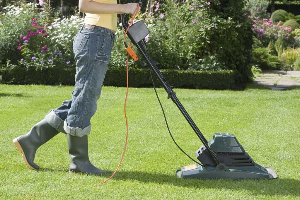 woman mowing the lawn