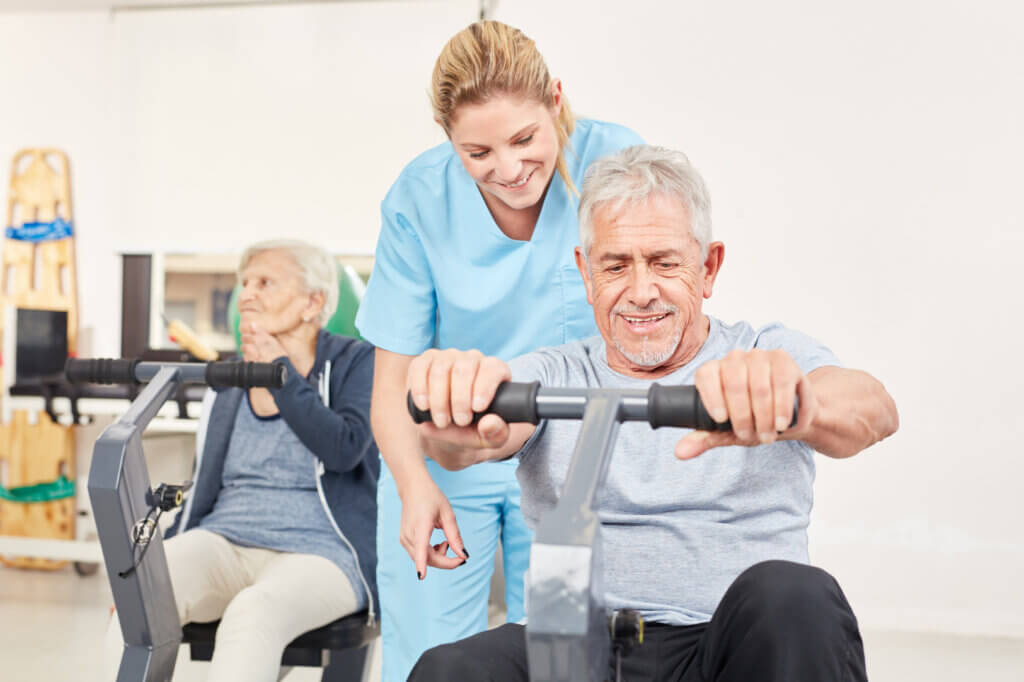 senior trains with exercise bike