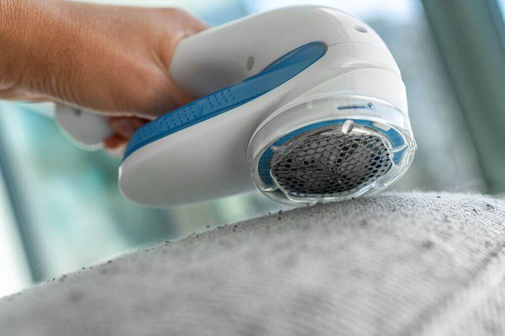 To effectively remove lint from upholstered furniture, a powerful shaver is necessary.