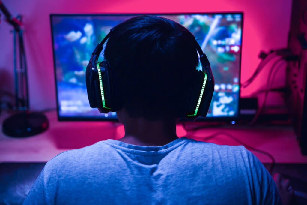 A headset with built-in lighting goes well with the rest of the bright and flashing gaming equipment.
