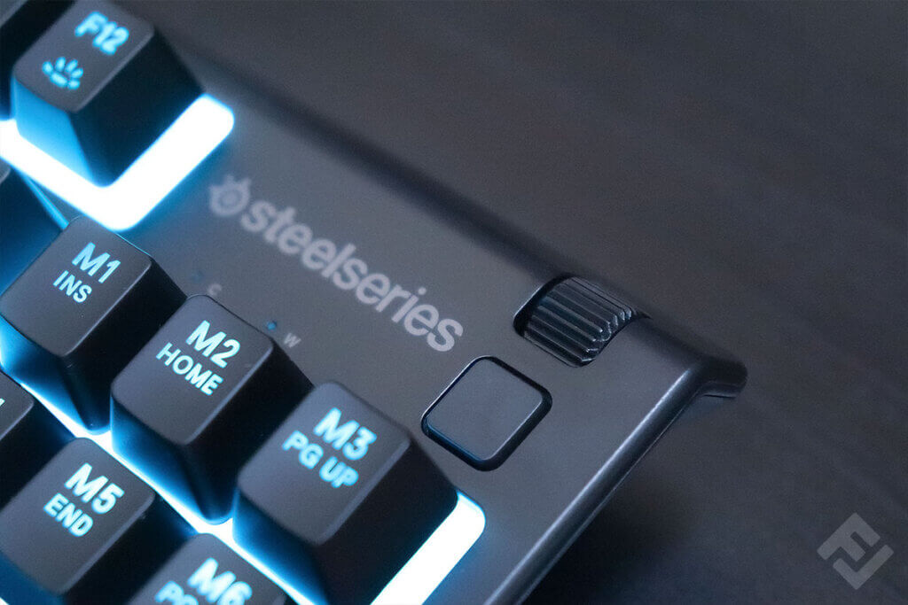 Close-up of multimedia button and roller of a SteelSeries Apex 3 TKL.