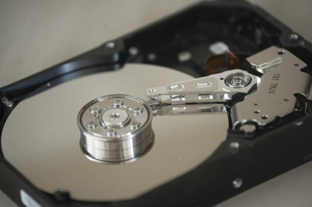A hard disk consists of moving components such as several magnetic disks and a read and write head.
