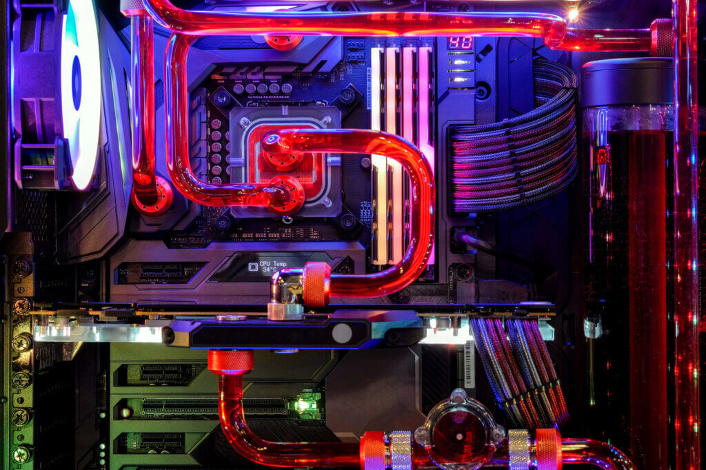 Water cooling systems lower the temperature of the individual components more efficiently and often come in colourful designs.
