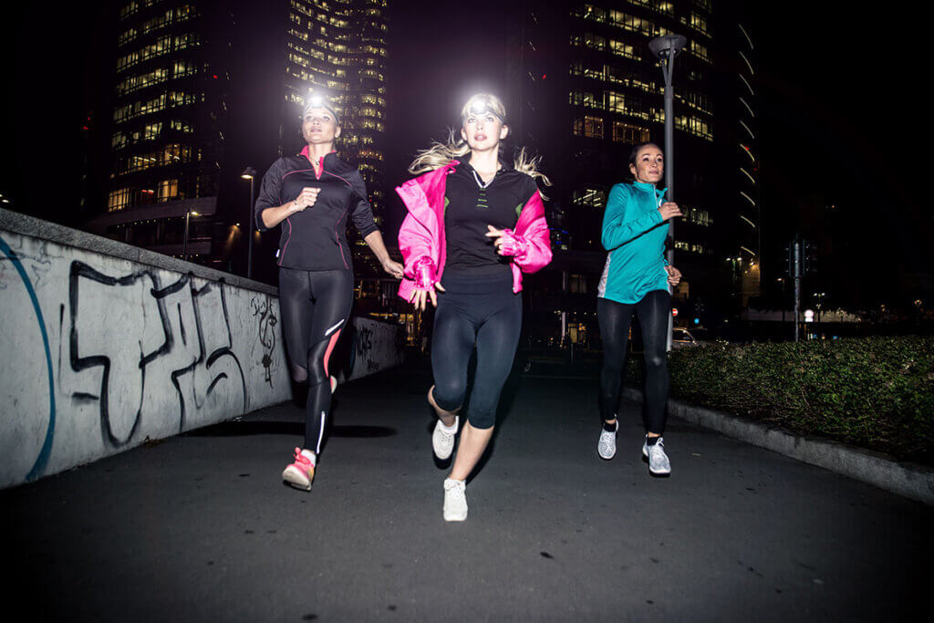 3 Women jogging in the dark