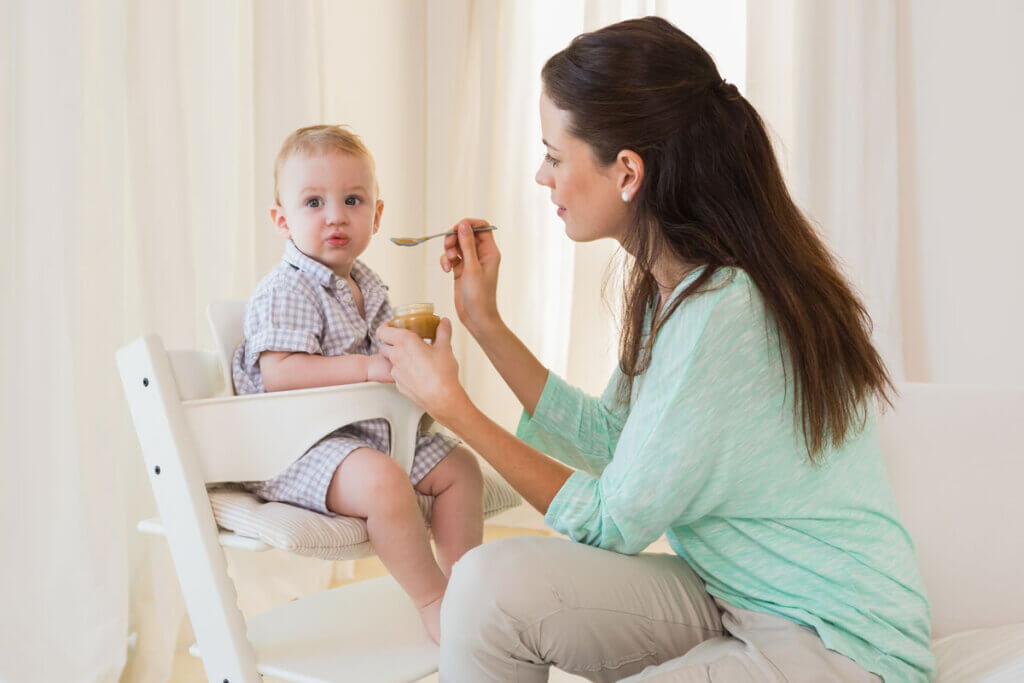 baby is fed by mother