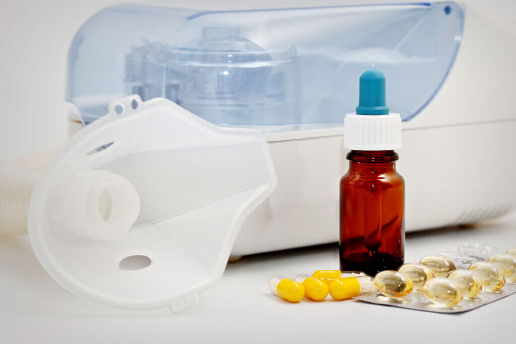 medications stand next to an inhaler
