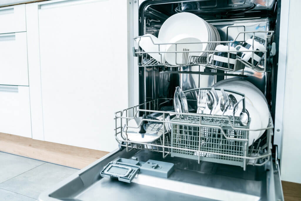  Open dishwasher with dishes inside