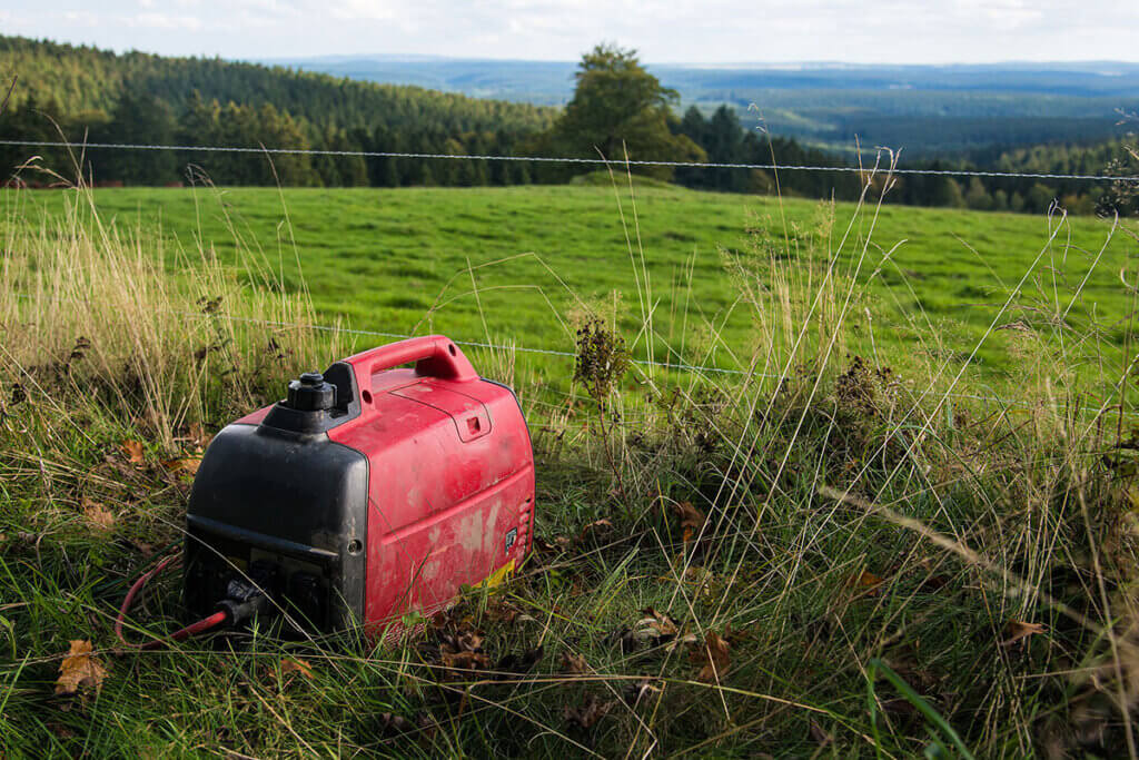 Inverter power generator stands on field