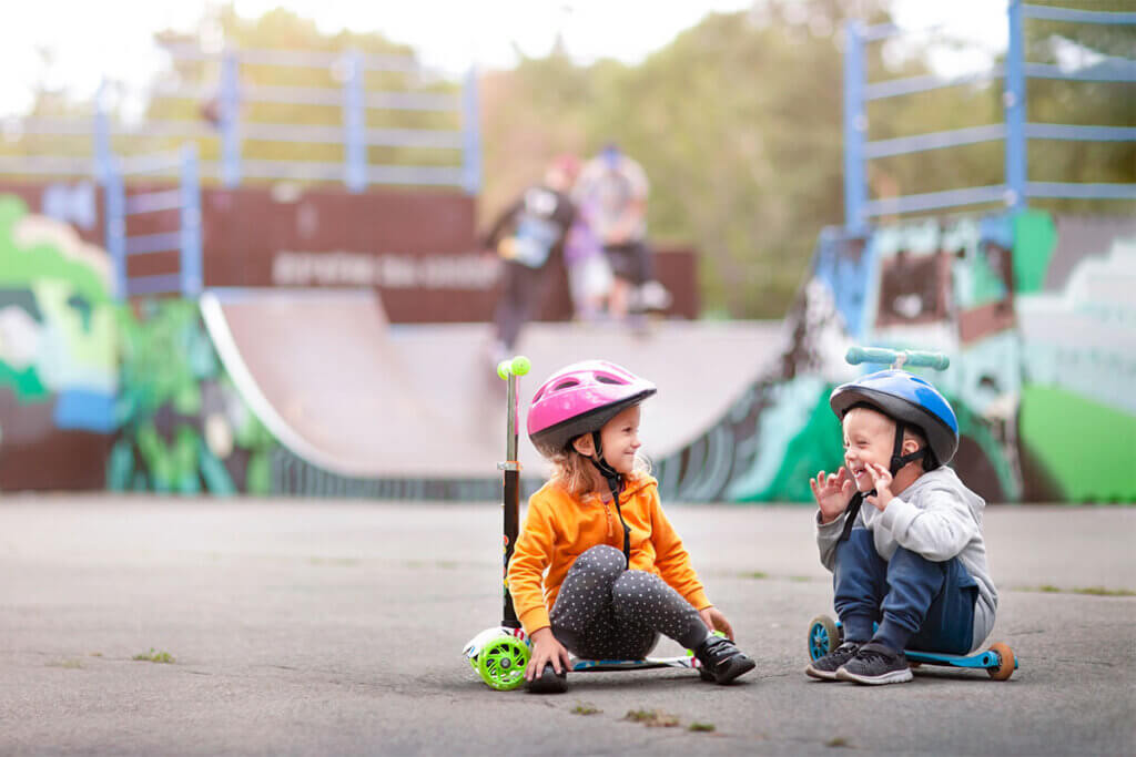 two children with their scooters