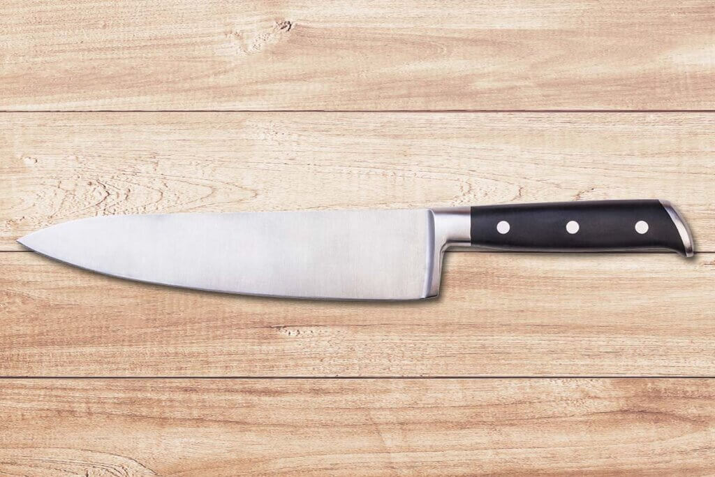 steel knife on a wooden background