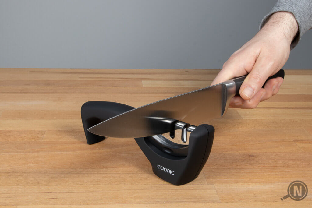 knife sharpener pull-through grinder in use