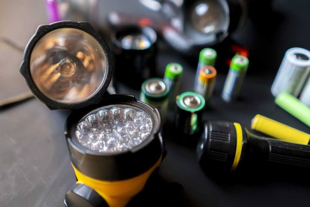 LED torches and rechargeable batteries on the same table