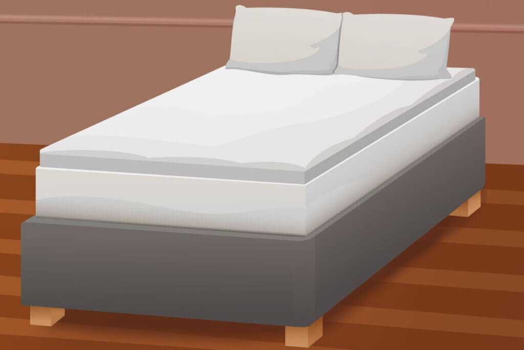 Memory foam mattress topper on a bed.