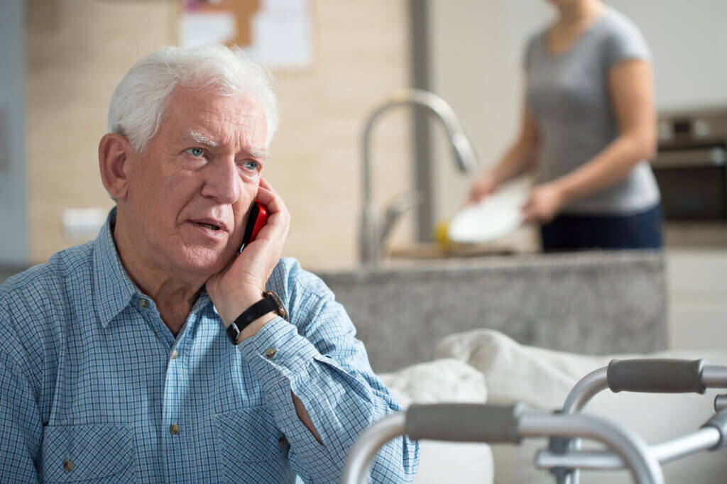 Senior calls with mobile phone