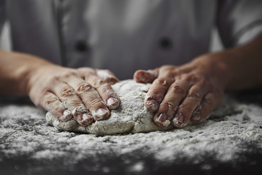 Knead pizza dough