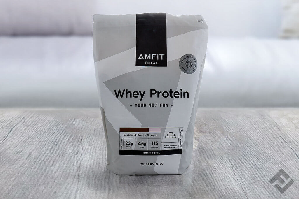 Bag of Amfit Nutrition Total whey powder Cookies and Cream on a table