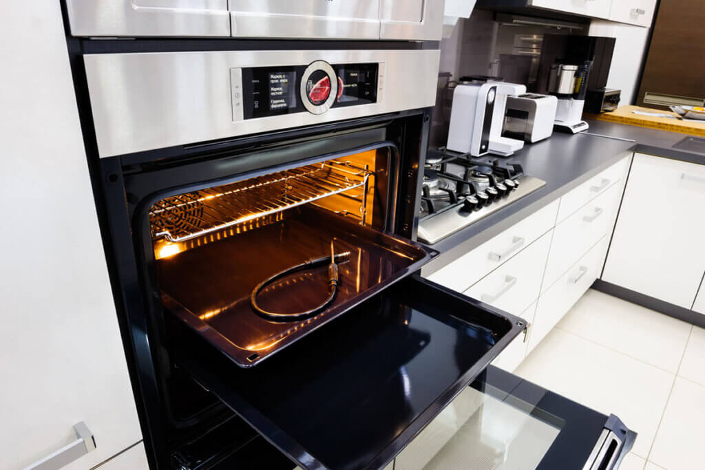 Open oven with baking trays