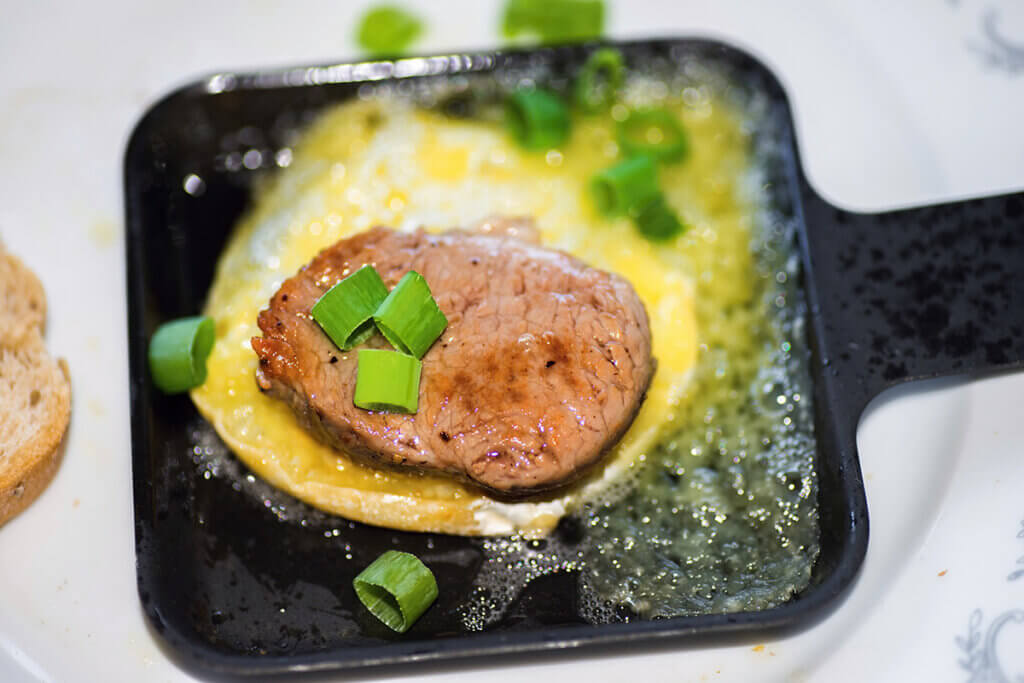 meat and egg in pan