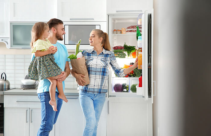 family with small child in kitchen
