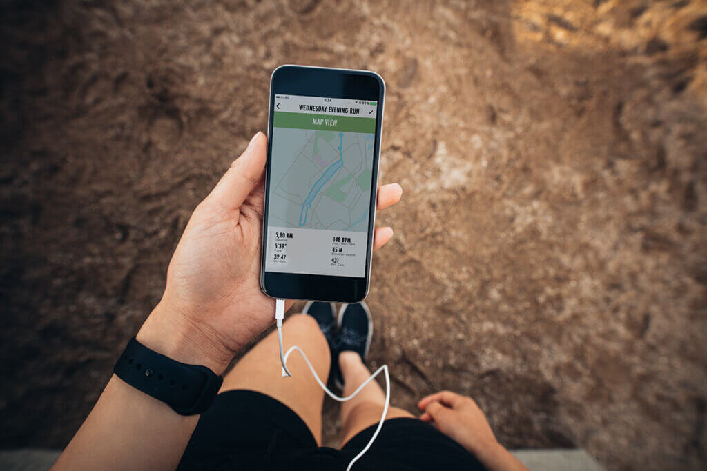 Jogger looks at smartphone for orientation