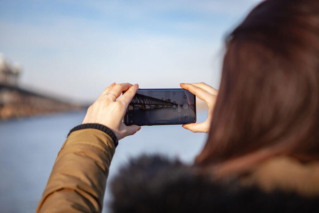 Woman taking photos with Samsung Galaxy S10