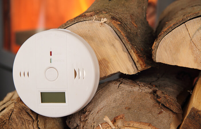 smoke alarm on fire wood