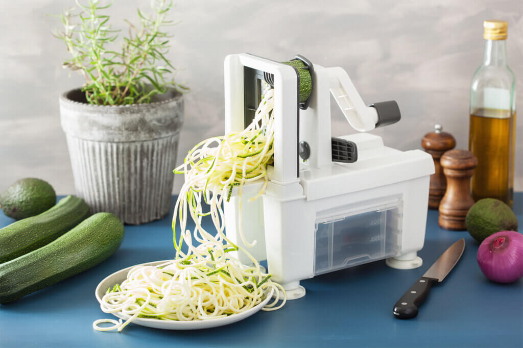 large spiraliser inthe kitchen with vegetables