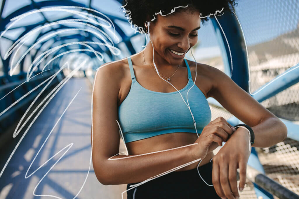 Woman checks their sport watch