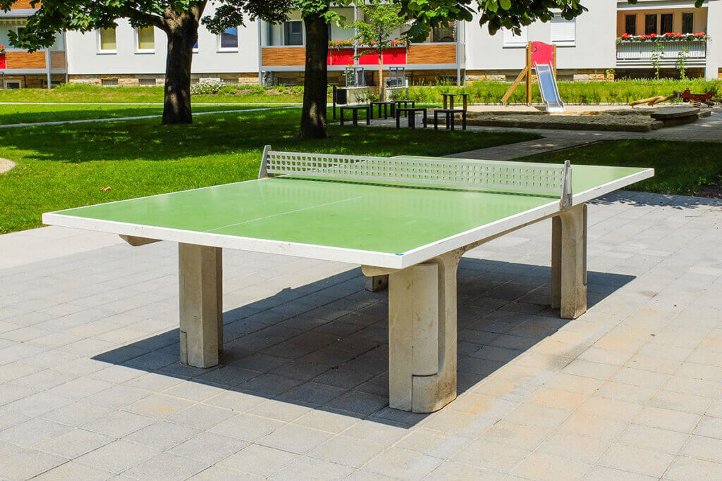 Outdoor table tennis table on a playground