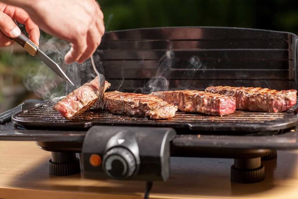 steak is prepared on the grill