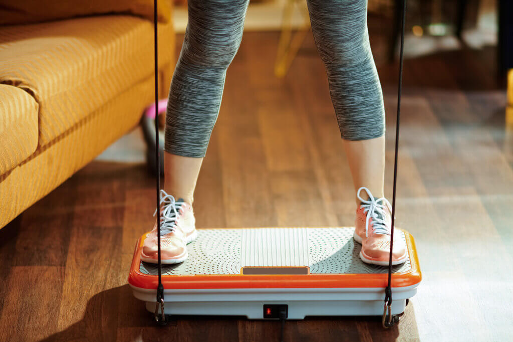 Woman on vibration plate